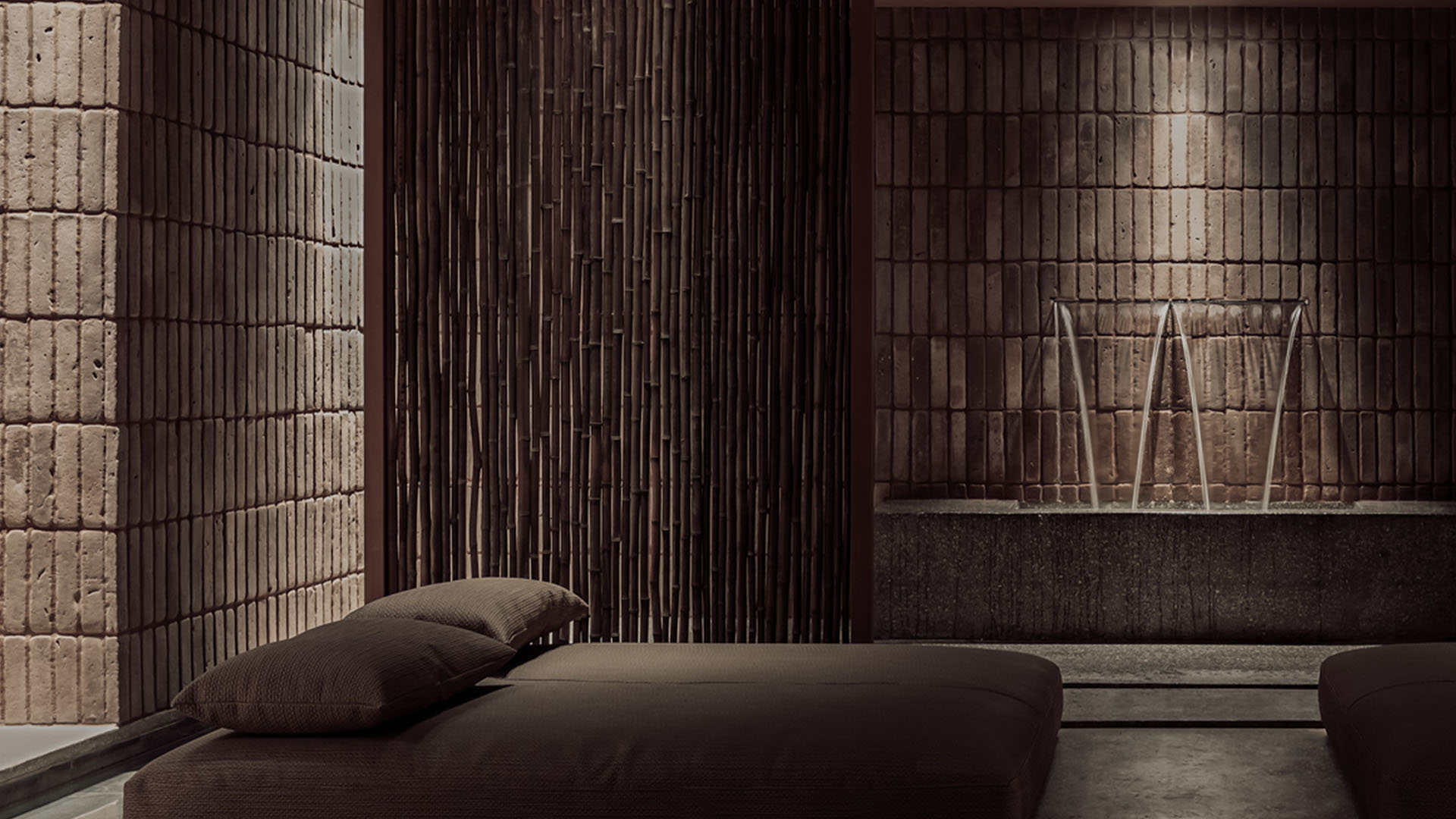 Minimal interior with natural stone walls, soft lighting and calm atmosphere